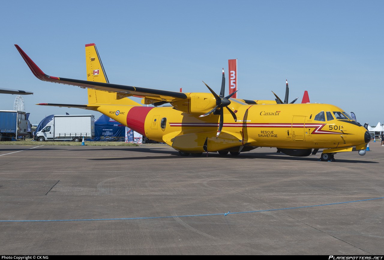 Yellow RCAF CC-295W Kingfisher 501 parked on an apron at an airshow.