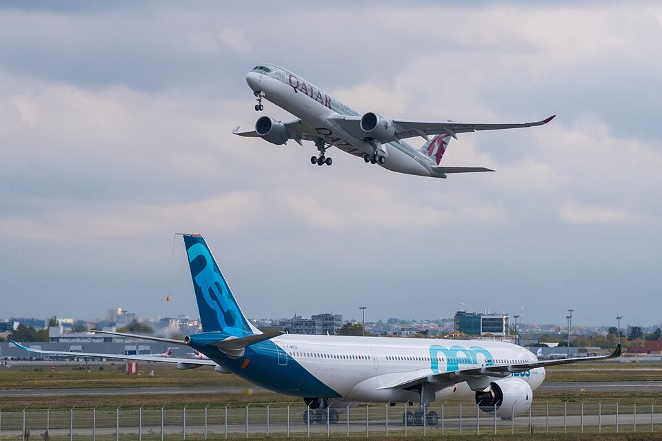 Airbus A330neo and A350 aircraft together, showing two modern Airbus wide-body families in the same airport scene.