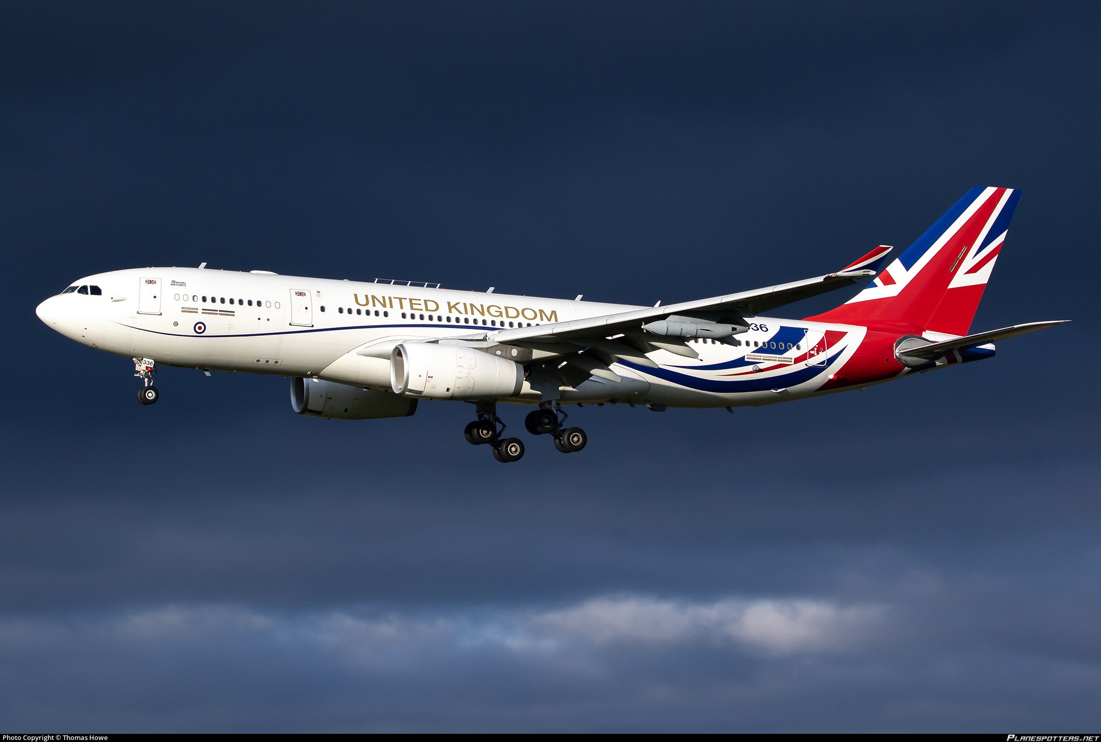 United Kingdom-liveried Airbus Voyager flying with landing gear extended.