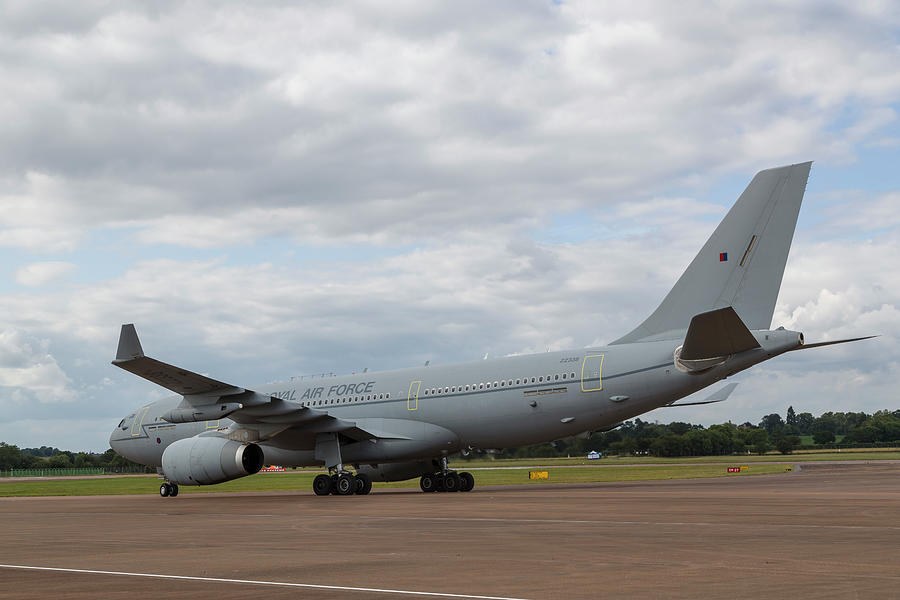 Gray Royal Air Force Airbus Voyager taxiing on an apron under cloudy sky.