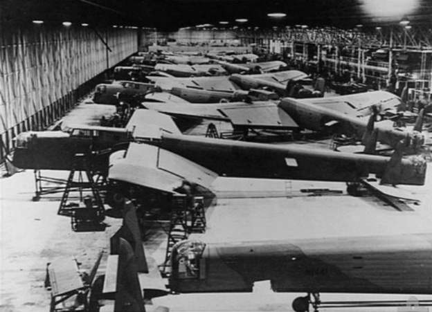 Rows of Armstrong Whitworth Whitley bombers under construction in 1941, showing wartime aircraft assembly inside the manufacturer's production facility.