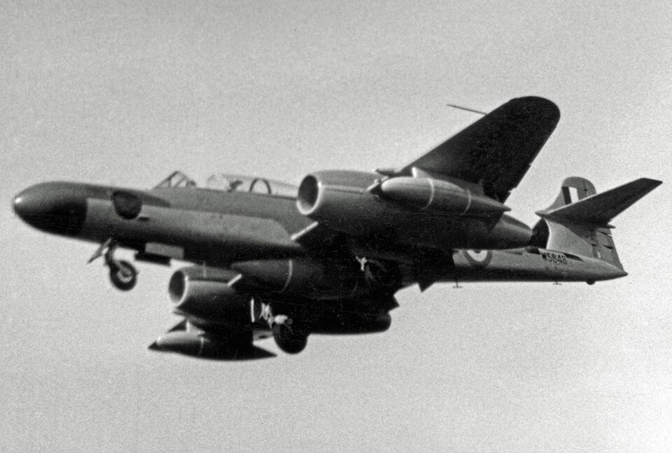 Gloster Meteor NF.14 WS848 in flight in a black-and-white photograph, showing the two-seat night-fighter nose and twin-jet layout associated with Armstrong Whitworth Aircraft production and modification work.