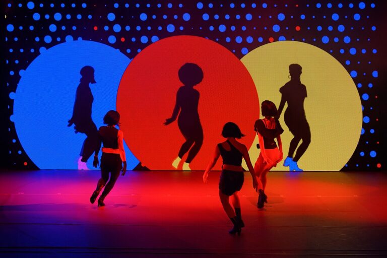 3 dancers performing on stage V-P