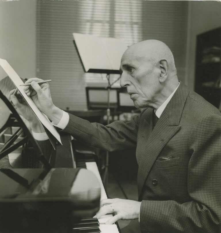 Portrait of the Italian composer Giorgio Federico Ghedini in his study while writing an orchestra score