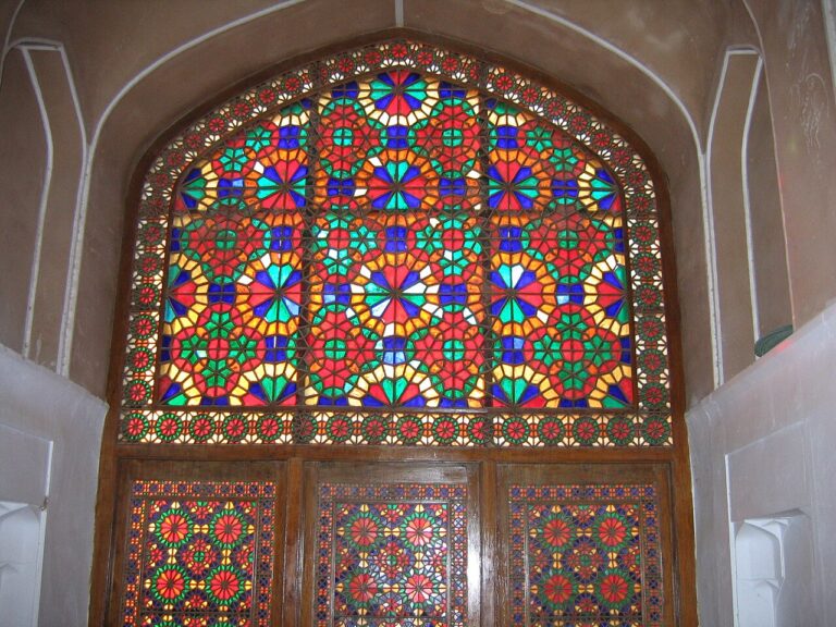 Wood window with geometric pattern and colorful glass