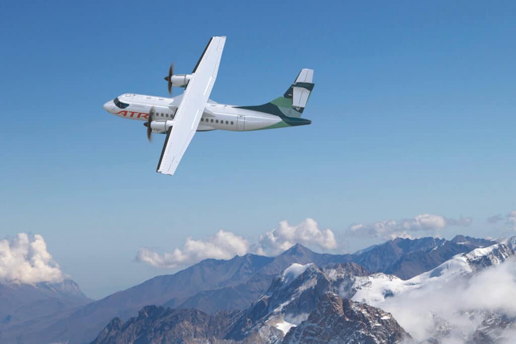ATR 42-600 turboprop aircraft in ATR livery flying above clouds.