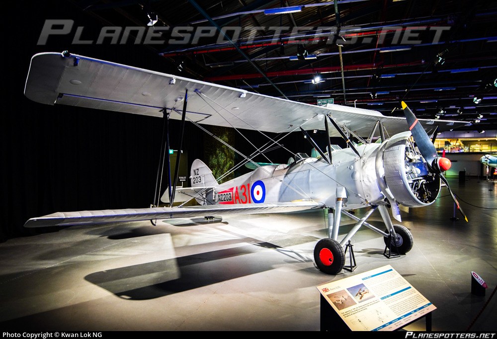 Avro 626 Prefect NZ203 in a museum viewed from the front quarter.