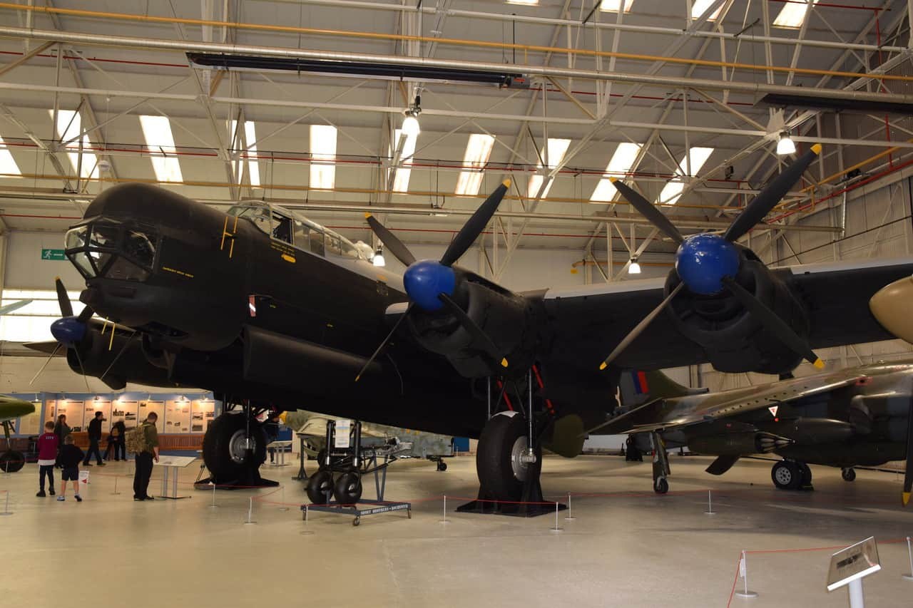 Preserved Avro Lincoln displayed indoors with blue propeller spinners.