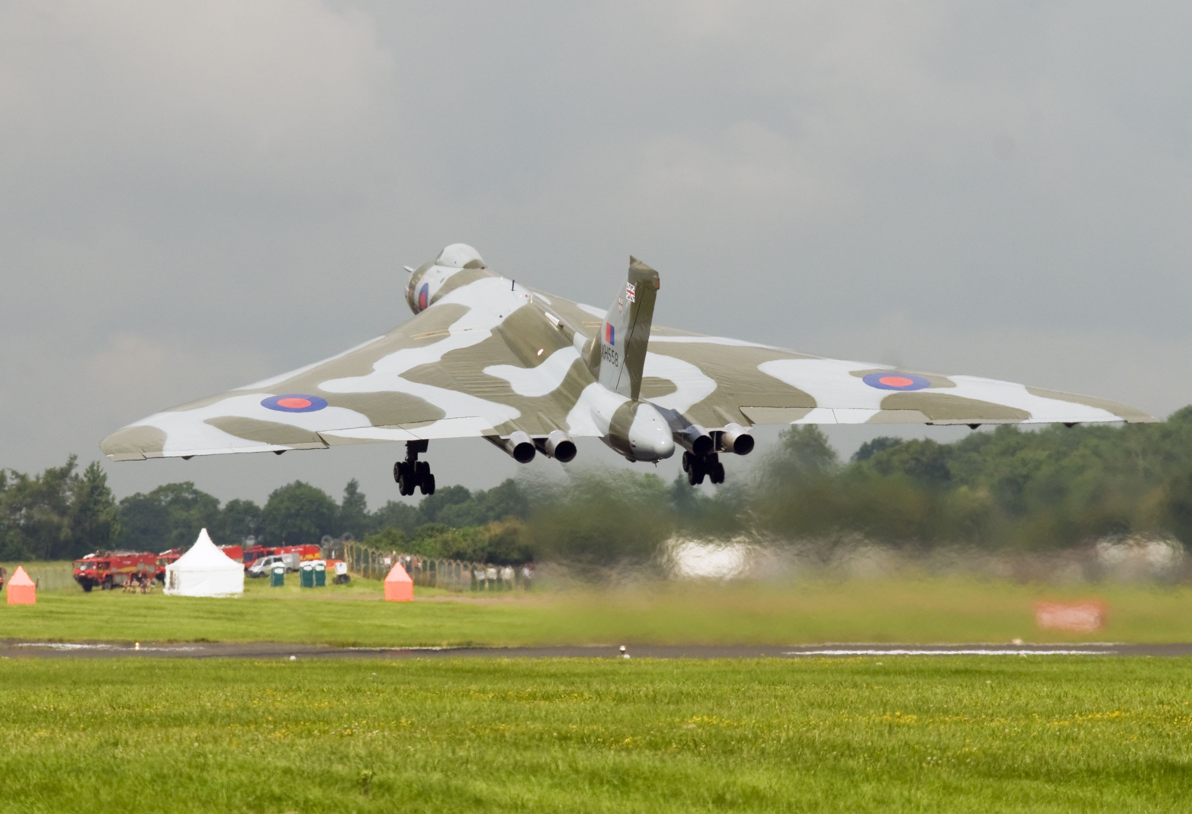 Avro Vulcan XH558 flying low with landing gear extended.