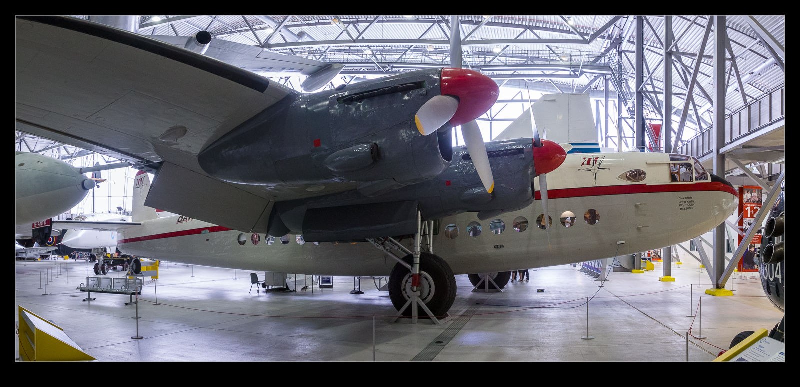 Avro York displayed indoors with red propeller spinners and red fuselage stripe.