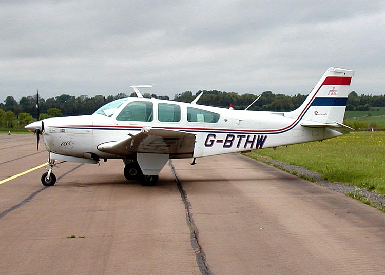 Beechcraft Bonanza on an airfield apron, showing the single-engine general-aviation aircraft line introduced by Beechcraft after World War II.