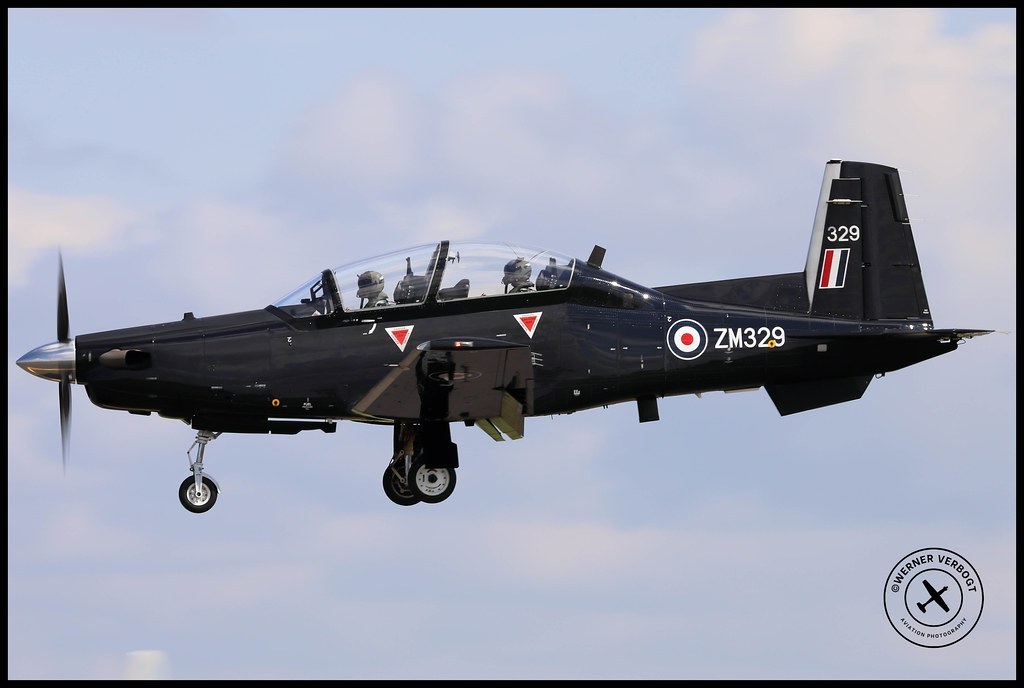 Black Beechcraft Texan T1 ZM329 in side view with gear down.
