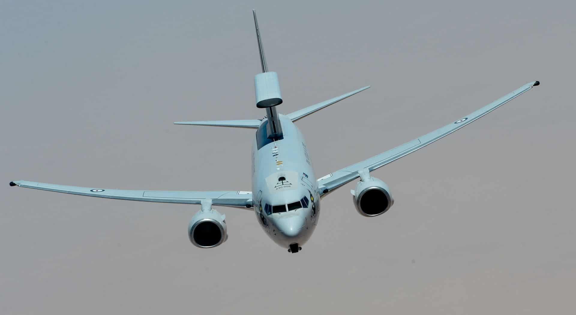 Boeing E-7 Wedgetail flying toward the camera with MESA radar above the fuselage.