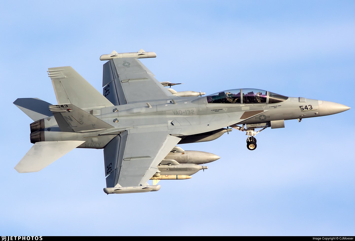 U.S. Navy Boeing EA-18G Growler 543 flying with landing gear extended.