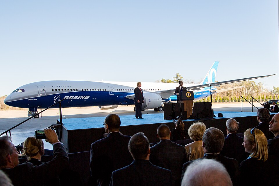 Boeing 787-10 rollout ceremony with the aircraft displayed in front of an audience, showing a major Boeing commercial wide-body program.