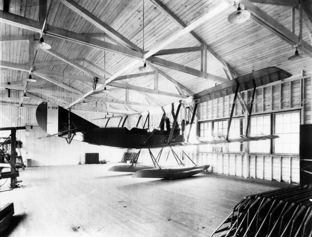 Boeing Model C floatplane A-650 inside a wooden hangar.