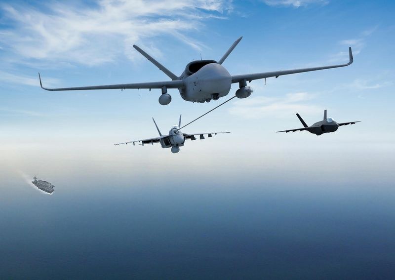 Rendered image of an MQ-25 Stingray refueling aircraft over the ocean near a carrier.
