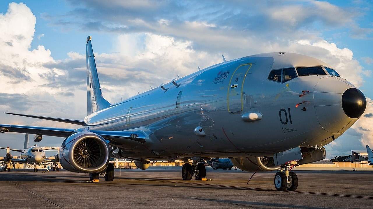 Royal Air Force P-8 Poseidon 01 parked on a ramp in evening light.