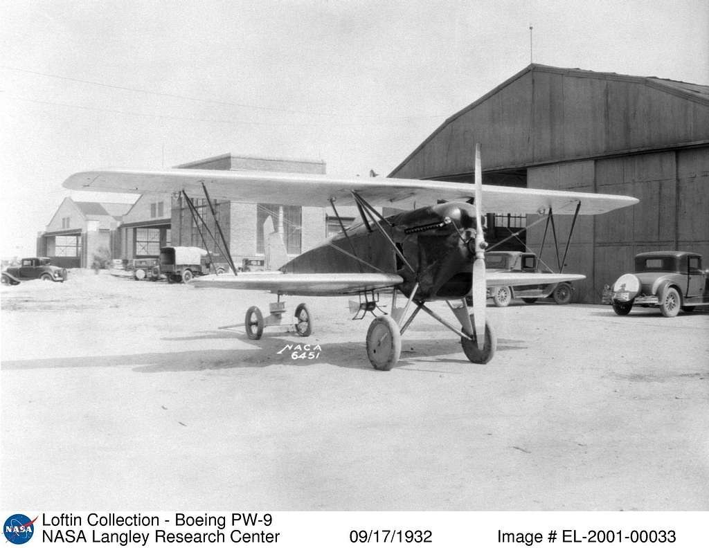 Boeing PW-9 biplane parked outside hangars at Langley in September 1932.