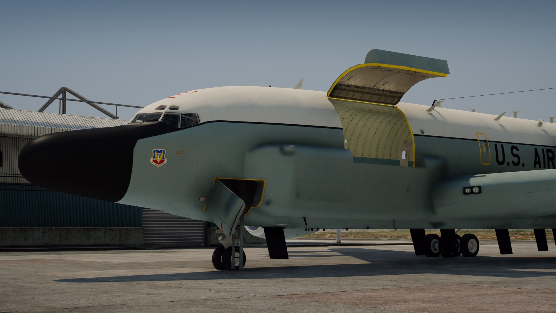 Close view of a U.S. Air Force RC-135 nose section with an upper panel open.