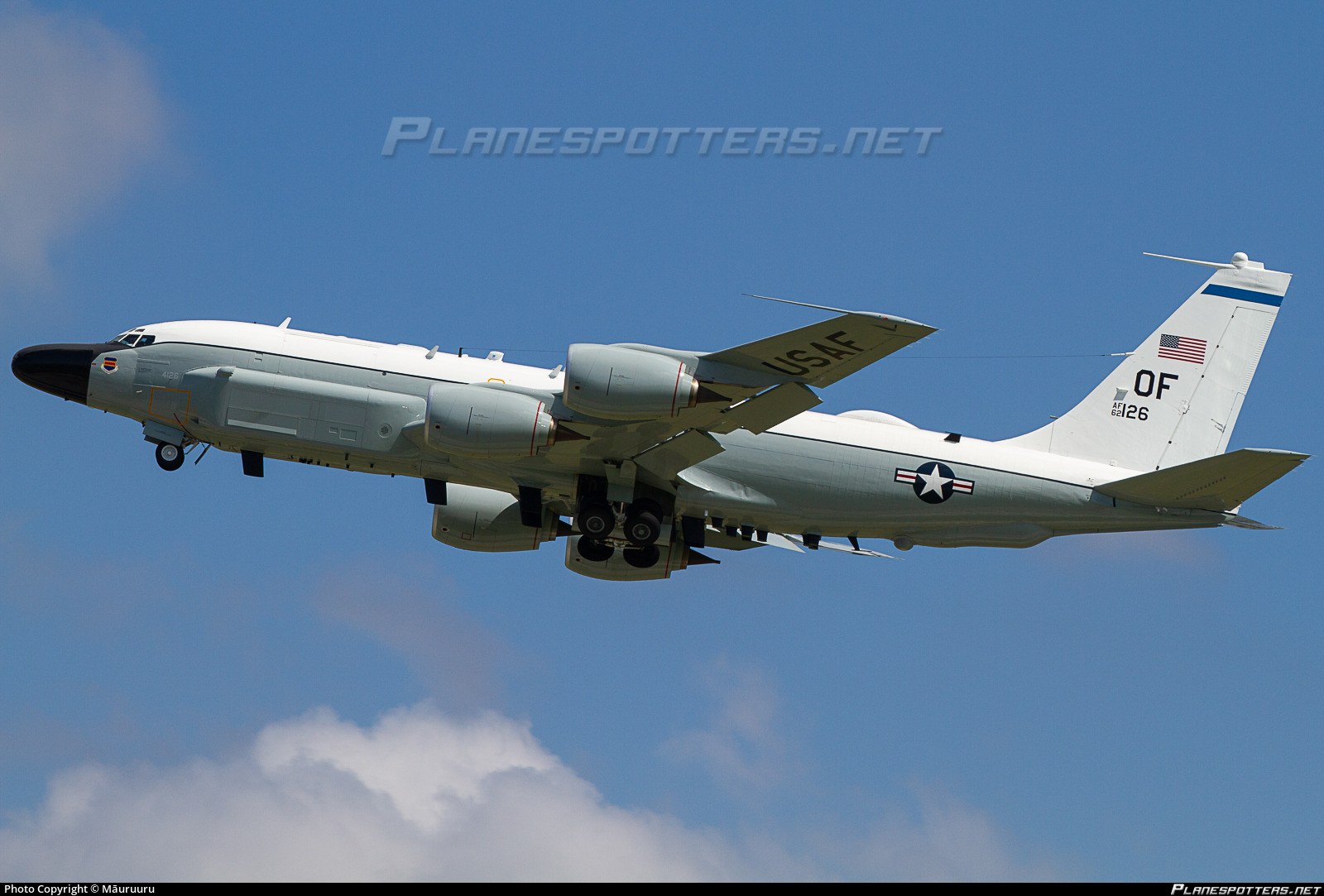 U.S. Air Force RC-135 aircraft OF 62-4126 flying with landing gear visible.