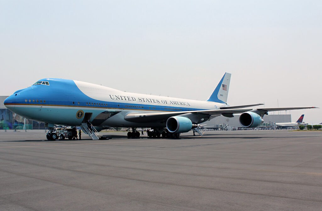 Boeing VC-25 parked on an airport ramp with stairs near the forward door.