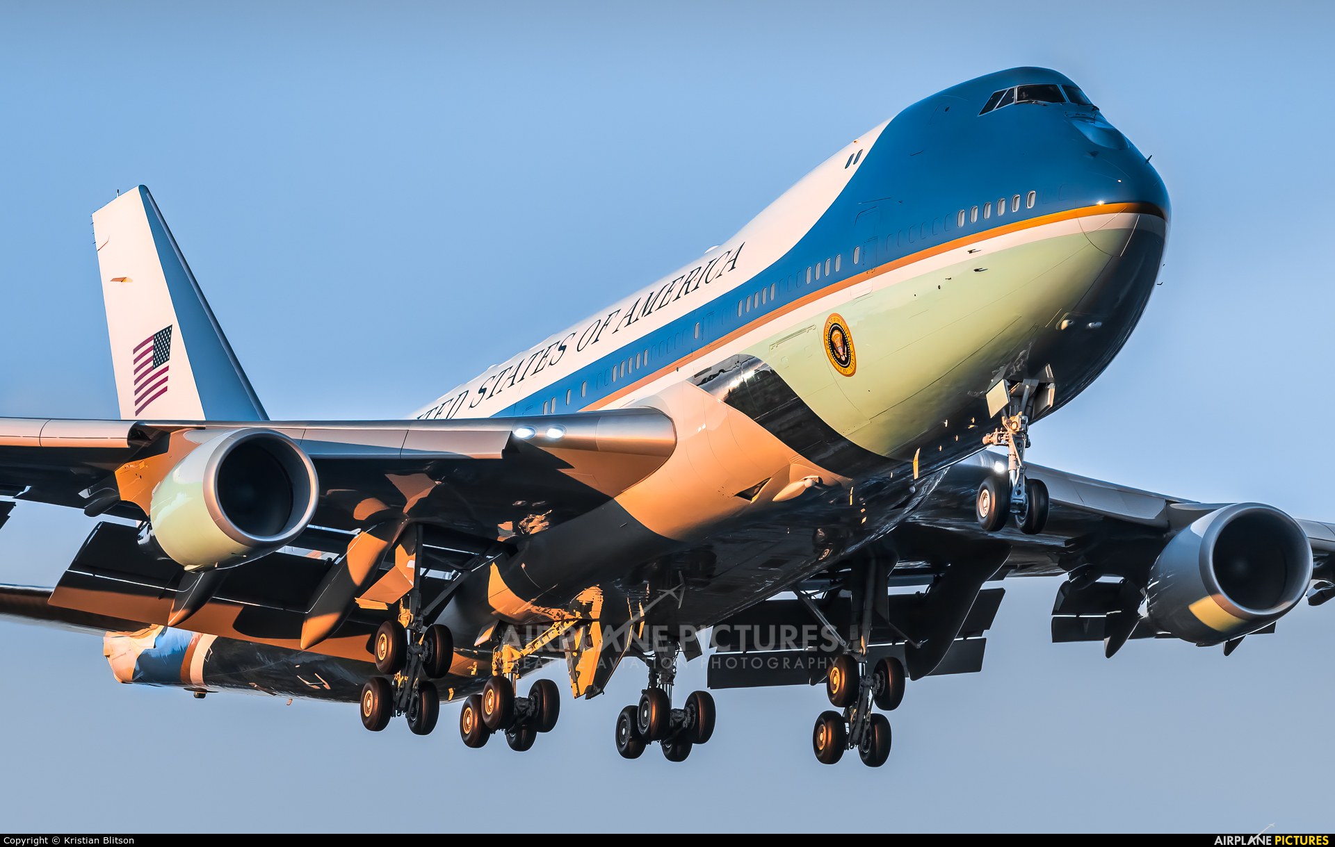Low front view of a VC-25 descending with landing gear down.