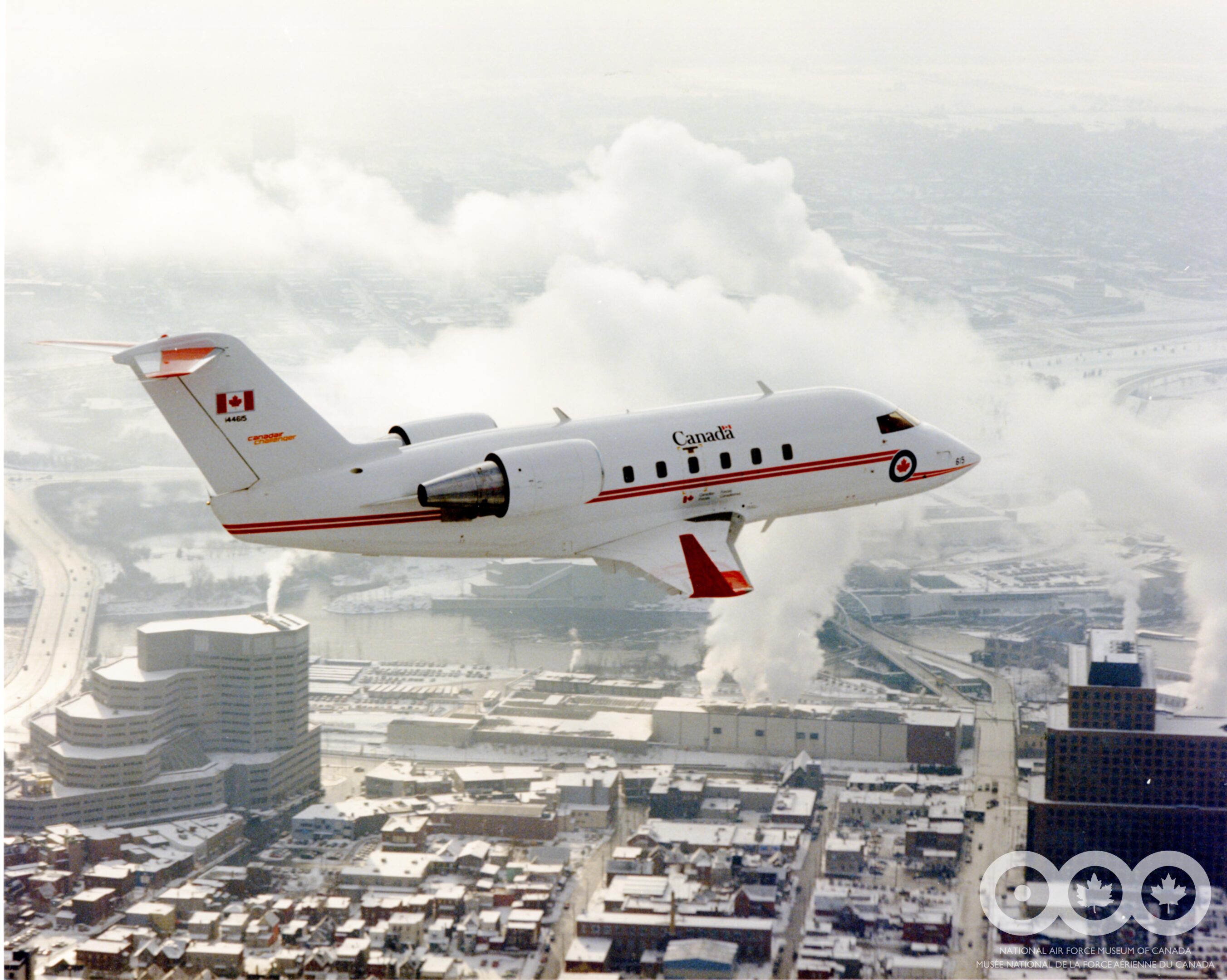 Canadair Challenger 14465 flying over snowy Ottawa in Canadian government markings.