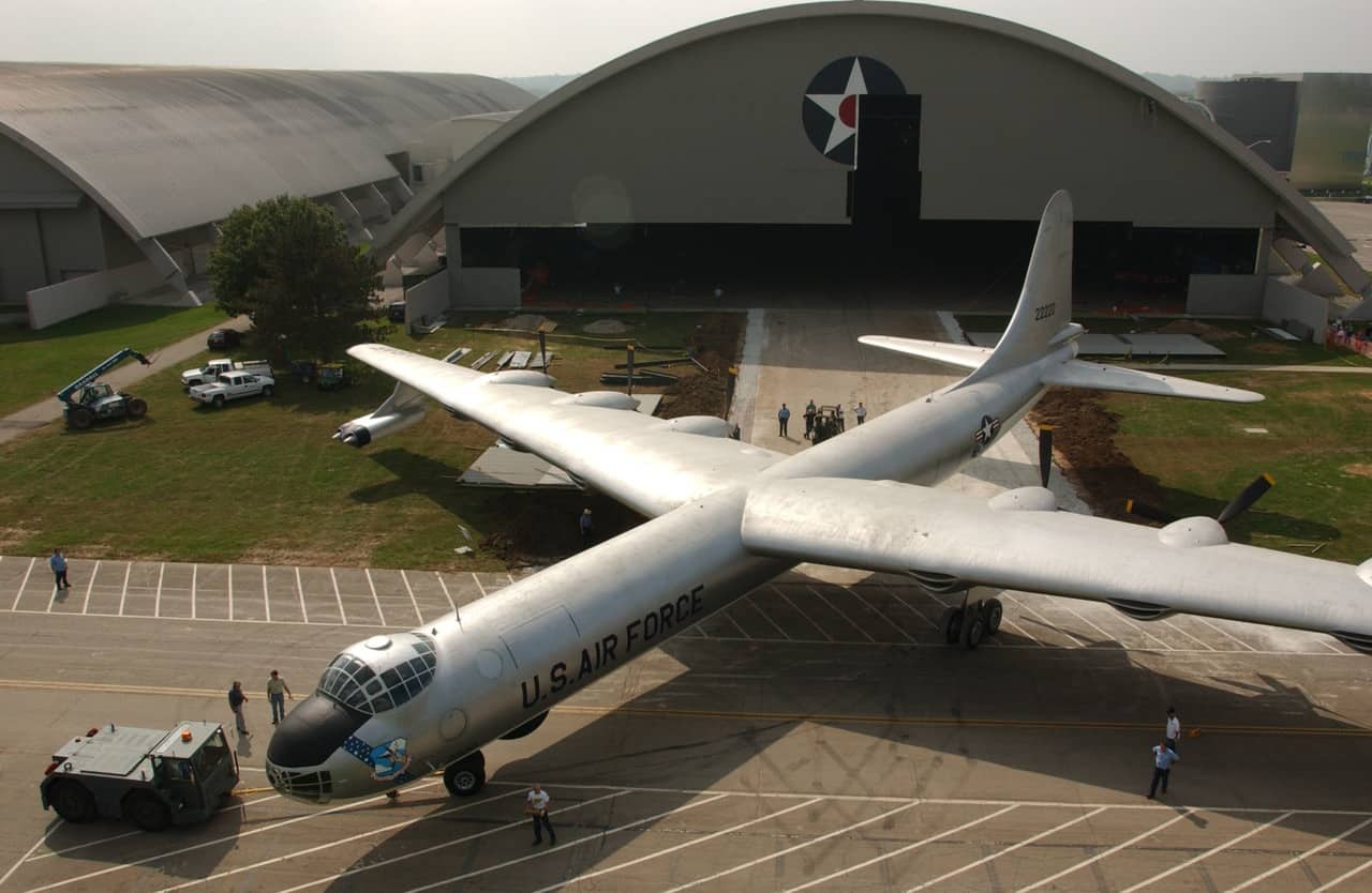 Convair B-36 Peacemaker nose and wings seen from above near a hangar.