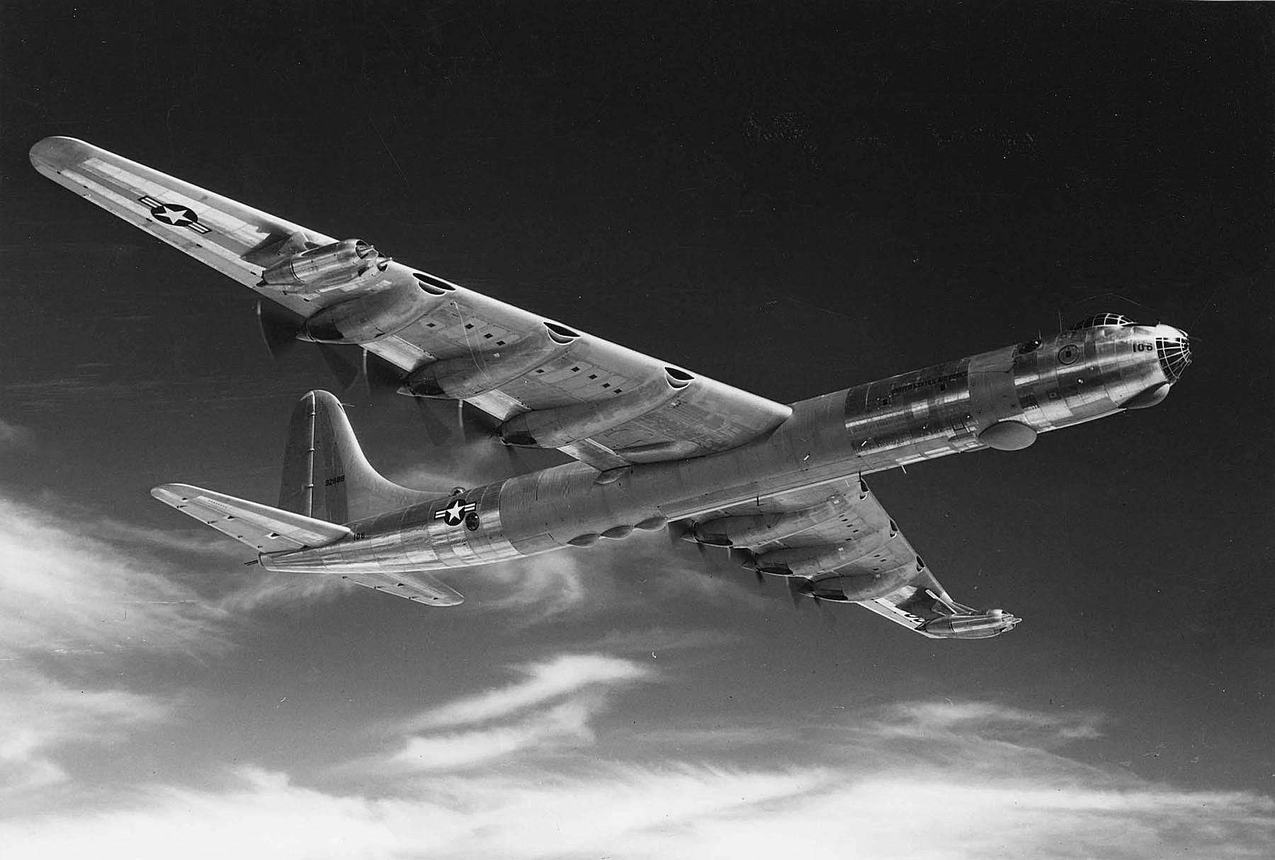Black-and-white overhead view of a Convair B-36 Peacemaker in flight.