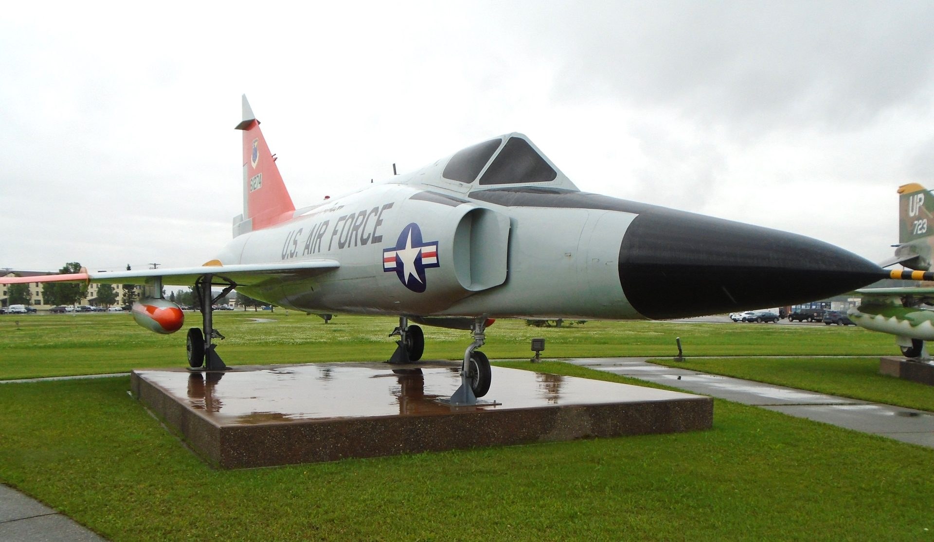 Convair F-102 Delta Dagger 92721 displayed on a wet outdoor pad.