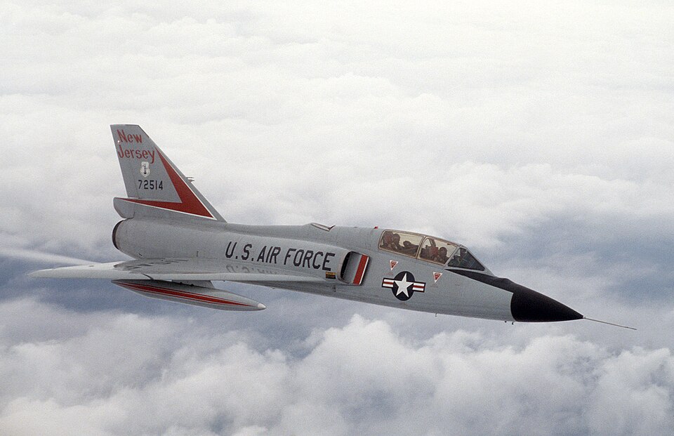 Convair F-106B Delta Dart in flight above clouds, showing the two-seat interceptor version of Convair's supersonic Delta Dart line.
