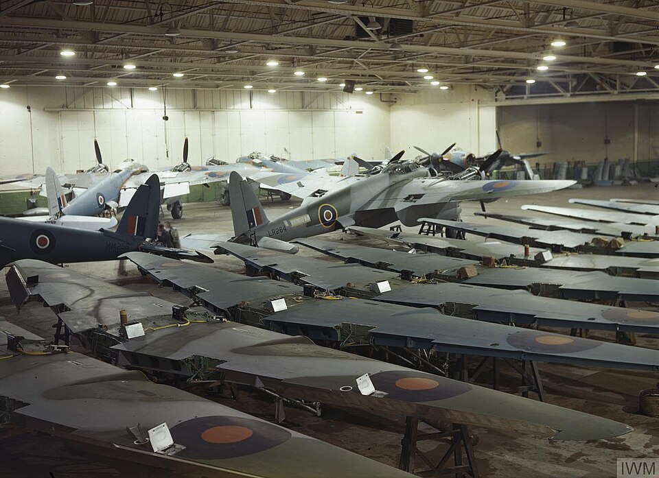 Workers building de Havilland Mosquito aircraft at the Hatfield factory in 1943, showing wartime production inside the company's manufacturing site.