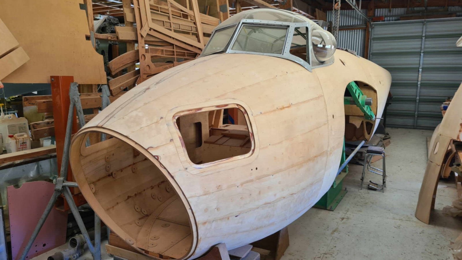 Forward wooden fuselage and cockpit section of a de Havilland Mosquito under construction.