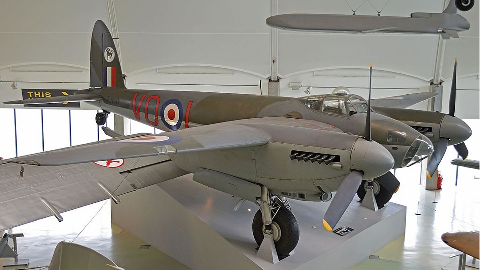 de Havilland Mosquito displayed indoors with RAF roundels and twin propellers.