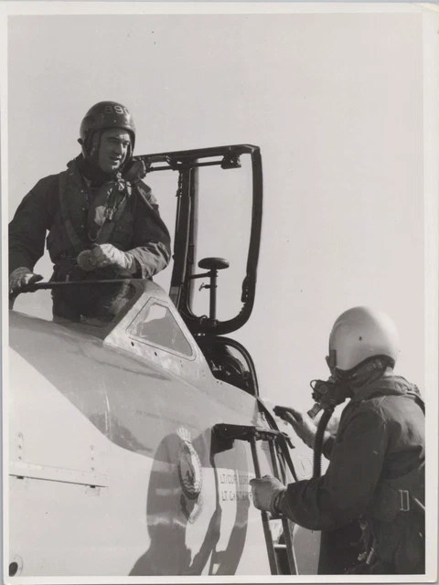 Black-and-white view of two crew members at a Sea Venom cockpit.