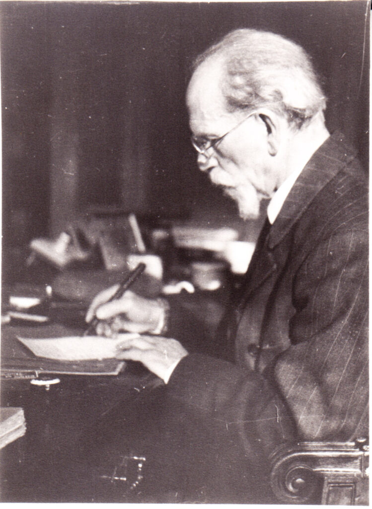 Husserl writing at his desk