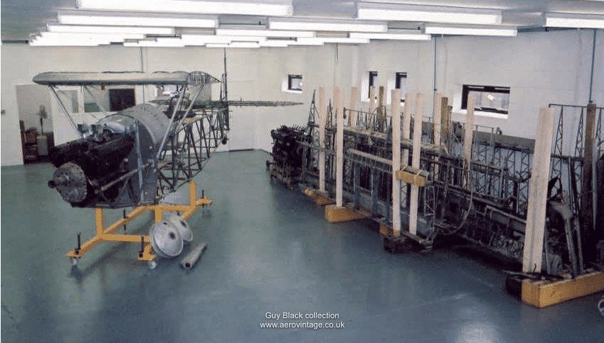 Partially assembled Hawker Audax airframe and wing sections inside a workshop.