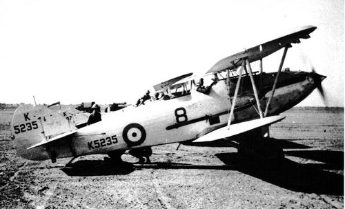 Black-and-white side view of Hawker Audax K5235 on a dry airfield.