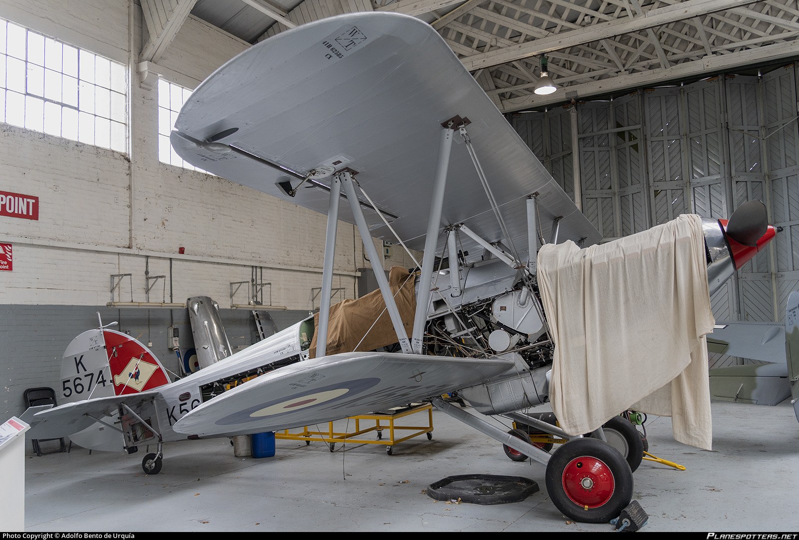 Hawker Fury K5674 indoors with fabric covering over the nose.