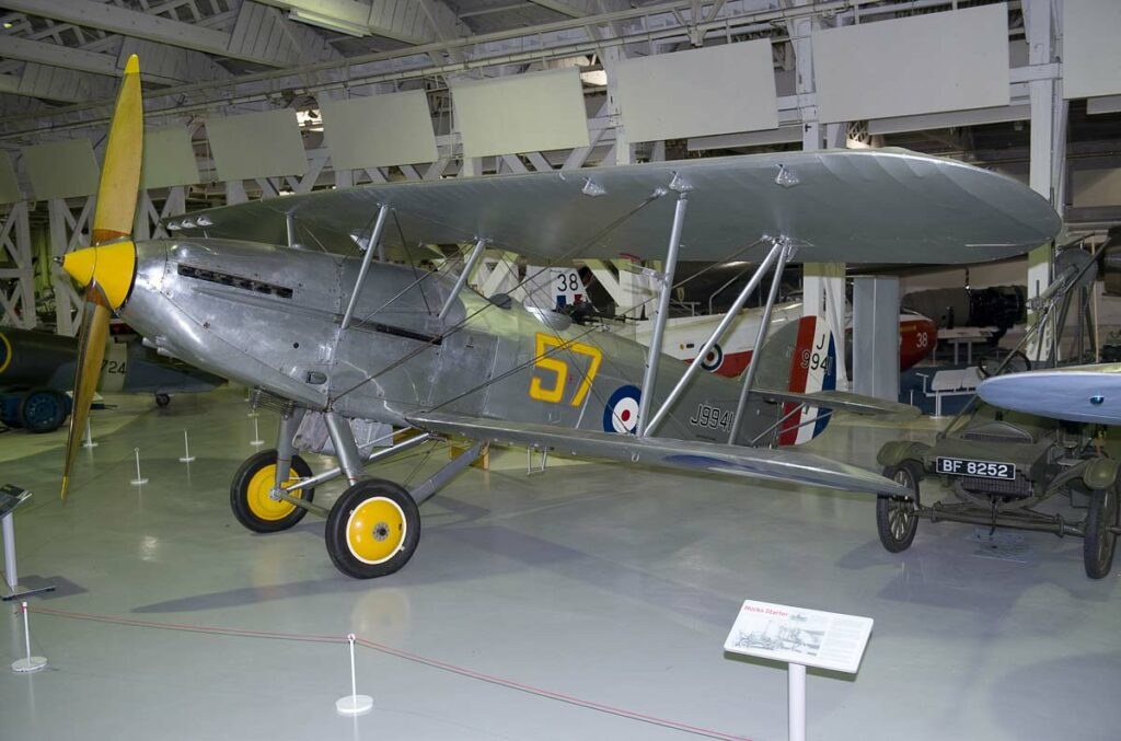 Silver Hawker Hart J9941 displayed indoors with yellow number 57.