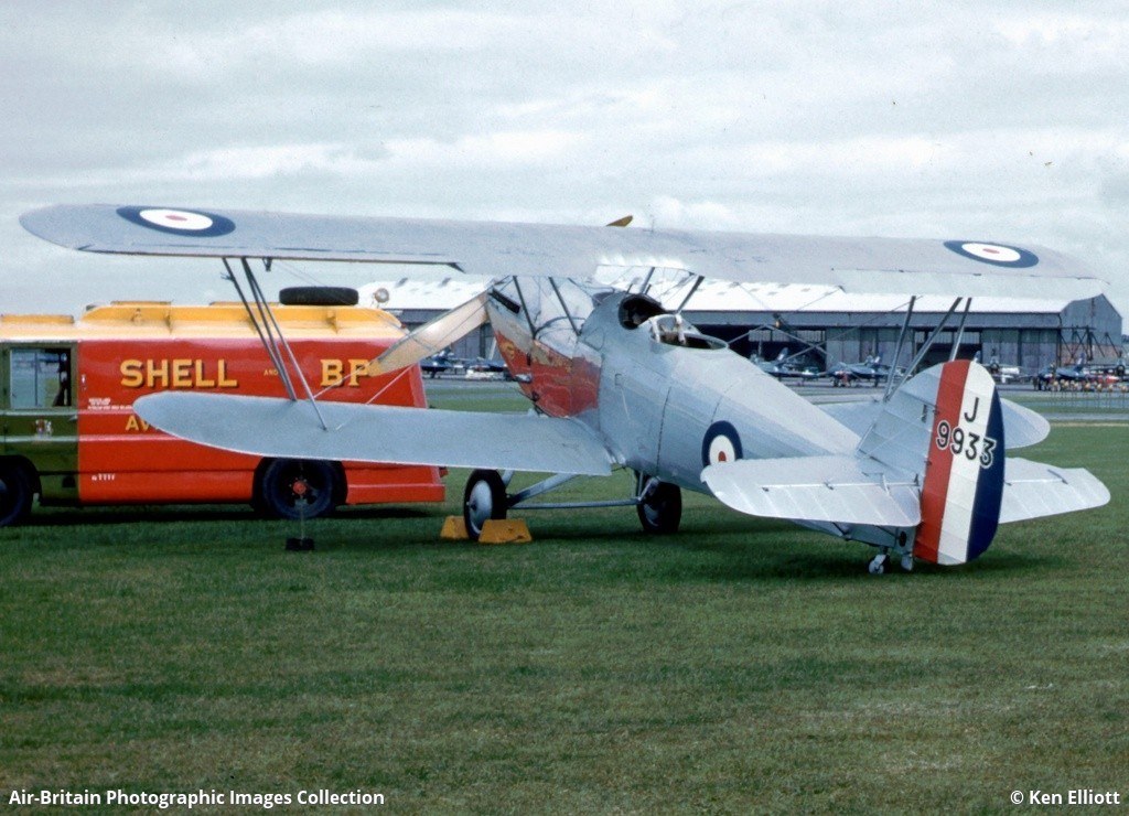Silver Hawker Hart J9933 parked on grass beside a Shell BP fuel truck.