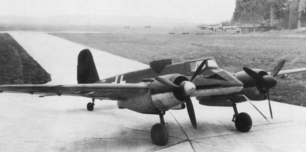 Henschel Hs 129 twin-engine attack aircraft parked on a field strip