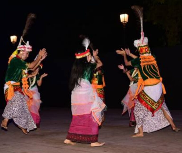 A group of men and women performing a classical Meitei dance, organized by the Sangeet Natak Akademi of the Ministry of Culture, Government of India, at India Gate