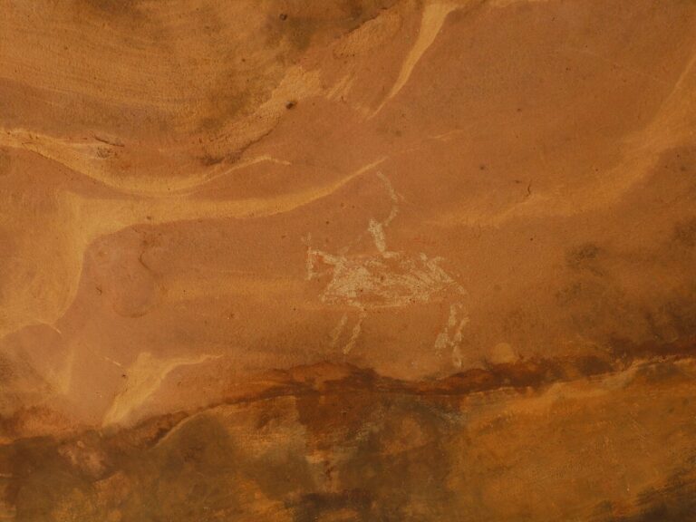 man riding horse prehistoric rock cave painting Bhimbetka Bhopal Madhya Pradesh India February