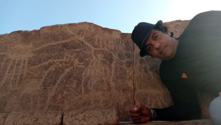 Anthropologist Yasser El Leithi monitors the carvings of animals such as giraffes