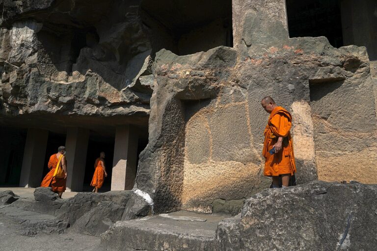 Buddhist Monks inside premises of Ajanta Caves, Maharashtra, India