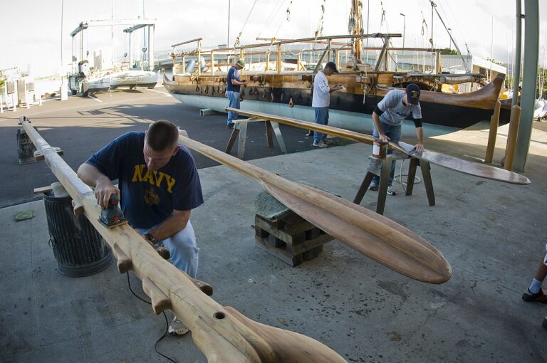US Navy N 6674H Sailors sand down pieces of a Polynesian canoe for the Polynesian Voyaging Society