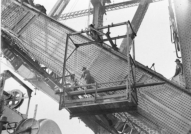 Riggers riveting the red hot rivets on the lower outside south chord, Sydney Harbour Bridge, Sam Hood