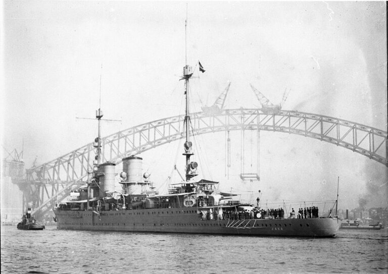 The "Java", a warship of the Dutch East Indies, berthing with the Sydney Harbour Bridge as a background, ca. Ted Hood